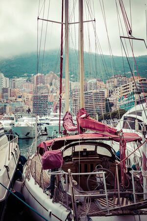 LA CONDAMINE, MONACO - JUNE 04, 2019: Yachts docked at Port Hercules in La Condamine harbour. Cityscape of Monte Carlo. Principality of Monaco.のeditorial素材