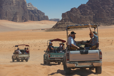 Bedouin's car jeeps and tourists, Wadi Rum desert in Jordan, Middle East.のeditorial素材