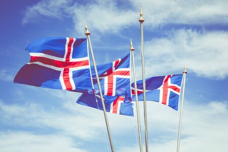 Iceland flag against summer sky. Reykjavik.の写真素材
