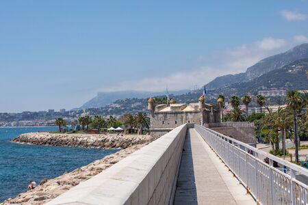 MENTON, FRANCE - JUNE 05, 2019: The bastion in port. Old town architecture of Menton on French Riviera. Provence-Alpes-Cote d'Azur, France.のeditorial素材