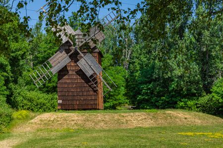 CHORZOW, POLAND - JUNE 27, 2019: A wooden windmill located in open-air museum in ChorzÃ³w. Heritage park. Upper Silesian Ethnographic Park in ChorzÃ³w.のeditorial素材