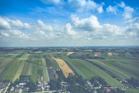 Aerial view of farmlands and mountains in rural Poland seen from drone. Summer time.の写真素材
