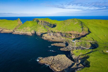 Aerial view of Mykines island in Faroe Islands, North Atlantic Ocean. Photo made by drone from...