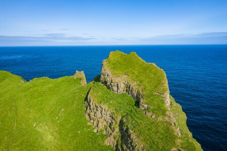 Aerial view of Mykines island in Faroe Islands, North Atlantic Ocean. Photo made by drone from...