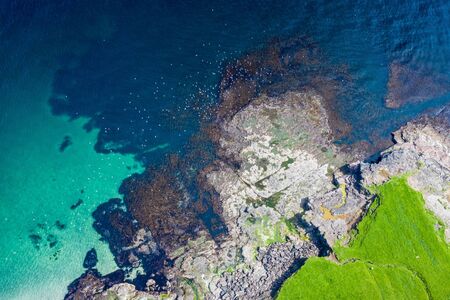 Aerial view of Koltur island in Faroe Islands, North Atlantic Ocean. Photo made by drone from above. Nordic Natural Landscape.の写真素材
