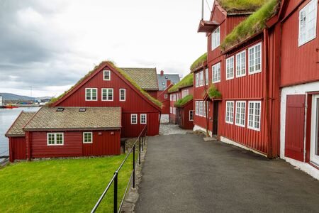 Old town of capital city of Torshavn. Typical houses with peat roof ( grass roof ). Faroes Islands. Denmark. Europe.の写真素材