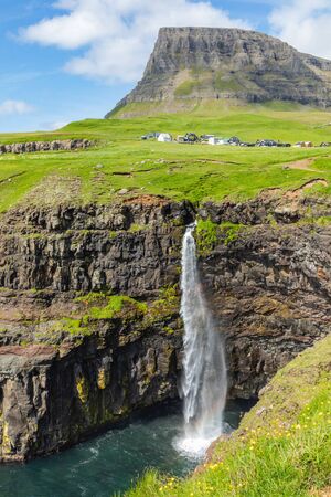 Mulafossur waterfall in Gasadalur village in Faroe Islands, North Atlantic Ocean. Nordic Natural Landscape.の写真素材