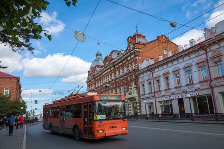 TOMSK, RUSSIA - SEPTEMBER 13, 2019: Urban transport on the road a small street of a provincial Russian city. Siberia. Russia.のeditorial素材