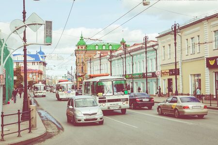 TOMSK, RUSSIA - SEPTEMBER 13, 2019: Urban transport on the road a small street of a provincial Russian city. Siberia. Russia.のeditorial素材