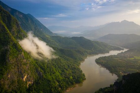 Aerial view of mountains and river Nong Khiaw. North Laos. Southeast Asia. Photo made by drone from above. Bird eye view.の写真素材