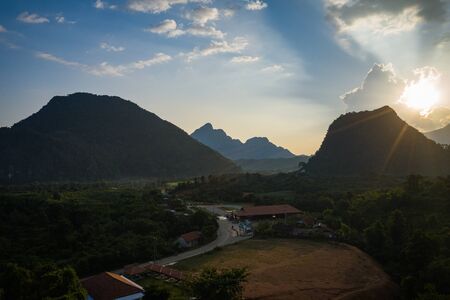 Aerial view of beautiful sunset at Vang Vieng , Laos. Southeast Asia. Photo made by drone from above. Bird eye view.の写真素材