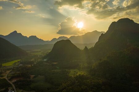 Aerial view of beautiful sunset at Vang Vieng , Laos. Southeast Asia. Photo made by drone from above. Bird eye view.の写真素材