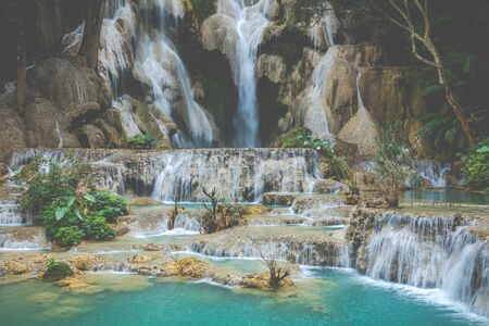 Turquoise water of Kuang Si waterfall, Luang Prabang, Laos. Tropical rainforest. The beauty of...
