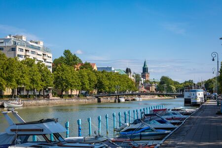 TURKU, FINLAND - AUGUST 02, 2019: View to the Aura river in Turku, Finland. Waterfront and harbour with ships and boats where are bars and restaurants. Turku is one of popular tourist destinations.のeditorial素材