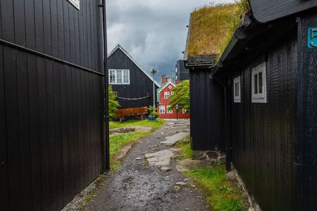 TORSHAVN, FAROE ISLANDS - JULY 05, 2019: Old town of capital city of Torshavn. Typical houses with peat roof ( grass roof ). Faroes Islands. Denmark. Europe.のeditorial素材
