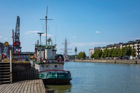 TURKU, FINLAND - AUGUST 02, 2019: View to the Aura river in Turku, Finland. Waterfront and harbour with ships and boats where are bars and restaurants. Turku is one of popular tourist destinations.のeditorial素材