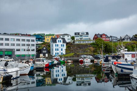 TORSHAVN, FAROE ISLANDS - JULY 05, 2019: Old town of capital city of Torshavn. Typical houses with peat roof ( grass roof ). Faroes Islands. Denmark. Europe.のeditorial素材