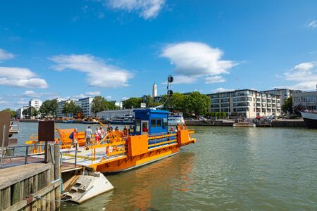 TURKU, FINLAND - AUGUST 02, 2019: View to the Aura river in Turku, Finland. Waterfront and harbour with ships and boats where are bars and restaurants. Turku is one of popular tourist destinations.のeditorial素材