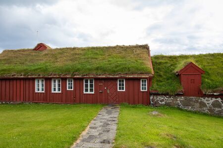 TORSHAVN, FAROE ISLANDS - JULY 05, 2019: Old town of capital city of Torshavn. Typical houses with peat roof ( grass roof ). Faroes Islands. Denmark. Europe.のeditorial素材