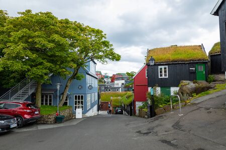 TORSHAVN, FAROE ISLANDS - JULY 05, 2019: Old town of capital city of Torshavn. Typical houses with peat roof ( grass roof ). Faroes Islands. Denmark. Europe.のeditorial素材