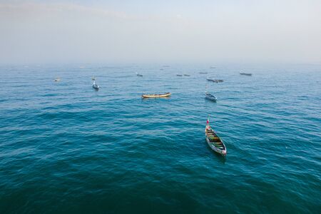 Aerial view of fishing village, pirogues fishing boats in Kayar, Senegal.  Photo made by drone from...