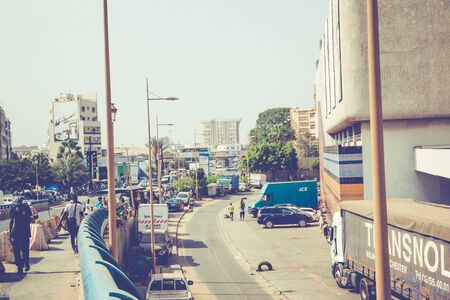 DAKAR, SENEGAL - NOVEMBER 11, 2019: People working and traffic at Senegal capital Dakar, West Africa.のeditorial素材