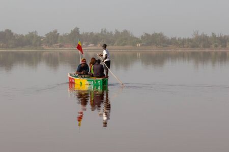 LAC ROSE, SENEGAL - NOVEMBER 13, 2019: People harvesting salt on Lac Rose or Lake Retba. Dakar. West Africa. UNESCO World Heritage.のeditorial素材