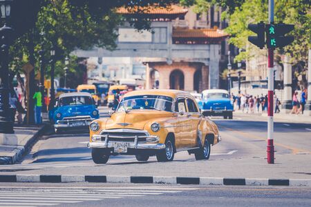 HAVANA, CUBA - DECEMBER 10, 2019: Vintage colored classic american cars in Old Havana, Cuba.のeditorial素材