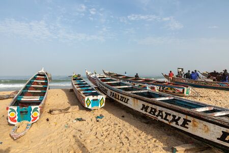 Traditional painted wooden fishing boat in Kayar, Senegal. West Africa.