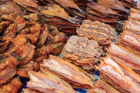 Nan khem or dried water buffalo skin and dried salted fish sold in Luang Prabang morning market in...