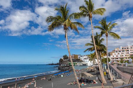 Puerto Naos beach an sunbathing people at beach with black lava sand at La Palma, Canary Island, Spain.の写真素材