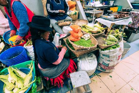 CUENCA, ECUADOR - FEBRUARY 11, 2020: Traditional ecuadorian food market selling agricultural products and other food items in Cuenca, Ecuador, South America.のeditorial素材