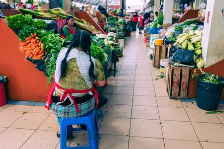 CUENCA, ECUADOR - FEBRUARY 11, 2020: Traditional ecuadorian food market selling agricultural products and other food items in Cuenca, Ecuador, South America.のeditorial素材
