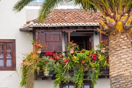 Famous ancient colorful balconies decorated with flowers. Santa Cruz - capital city of the island of La Palma, Canary Islands, Spain.の写真素材