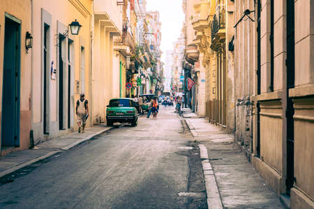 HAVANA, CUBA - DECEMBER 10, 2019: Havana Cuba Classic Cars. Typcal Havana urban scene with colorful...