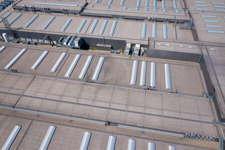 Industrial. Aerial view of large roof of factory.  Drone shot from above.の写真素材