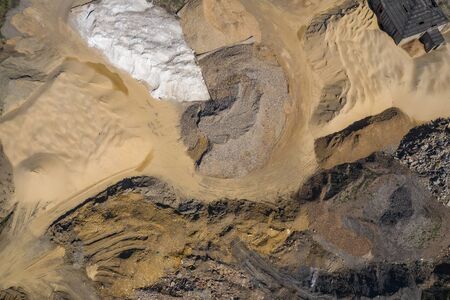 Aerial view of industrial mineral open pit mine. Opencast mining. Drone view from above.