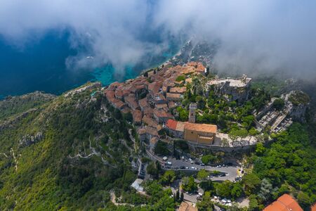 Aerial view of medieval village of Eze, on the Mediterranean coastline landscape and mountains,...