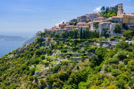 Aerial view of medieval village of Eze, on the Mediterranean coastline landscape and mountains,...