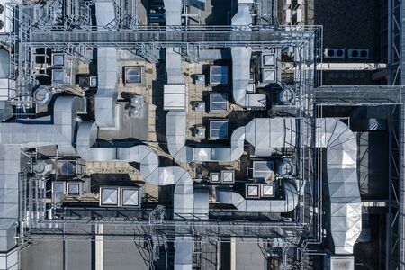 Air Condition Ventilation System on the Building Roof. Industrial Air system of ventilation and Air conditioning. Aerial Shot.の写真素材
