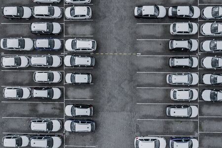 New car lined up aerial view. Port of import and export business logistic to dealership for sale....