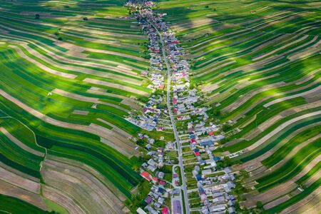 Poland from above. Aerial view of green agricultural fields and village. Landscape with fields of Poland. Typical polish landscape.の写真素材