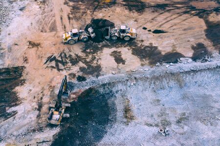 Open Pit Mine Top View. Aerial view of industrial mineral open pit mine. Opencast mining. Factory...
