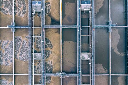Sewage Farm Aerial View. Clarifying tanks and green grass. Top view of sewage treatment plant. Geometric background texture.の写真素材