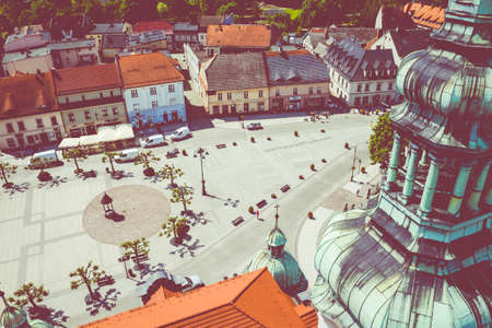 PSZCZYNA, POLAND - JUNE 04, 2020: Aerial view of main market square in historical european city. Colorful old buildings and clear blue sky. Pszczyna, Upper Silesia, Poland.のeditorial素材