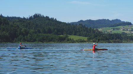 People spending free time kayaking on the lake Czorsztyn in Polandの写真素材