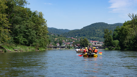 People floating in a pontoon on the riverの写真素材