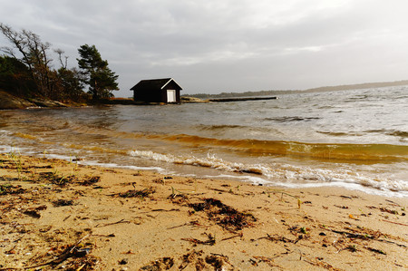 Norwegian garage for boat over the fjordの写真素材