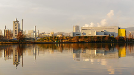 Round metal silos, porcelain factory, an island in the fjord, autumn day, the city of Porsgrunn, Skien. South Norway. Telemark region of Norwayの写真素材