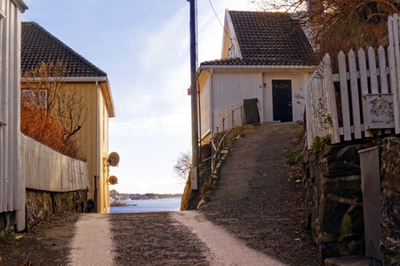 Arendal, Aust-Agder. Norway - February 2015. Road between buildings on tcoast of city Arendal. City popular for its tourist attractions. Aust-Agder region. North Sea Coast.のeditorial素材